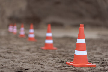 safety cones on the sand