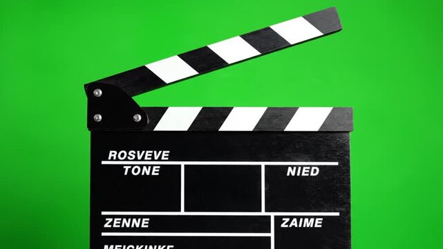 A high-definition 4K animation of a film production clapperboard isolated against a vibrant chroma key green background.