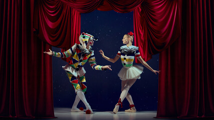 Naklejka premium Theater dialogue. Mime and ballerina performing expressive motion in red curtain frame. Concept of visual storytelling, creativity, and emotion for magazines, posters, and art media.