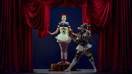 Unexpected gesture. Mime offering gift to ballerina during stage act. Concept of kindness, humor,...