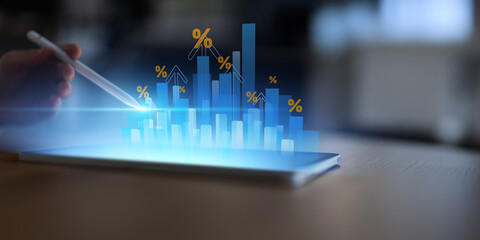 Financial Growth and Rising Interest Rates Visualization on Digital Tablet.