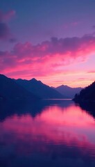 Pink twilight sky over still lake, distant dark mountain range silhouette , design, photography, palette