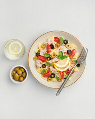 Tuna Pasta Salad on grey background, top view