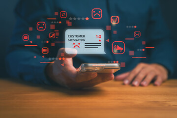 Customer holding smartphone showing one-star negative review and sad face icon, representing poor...