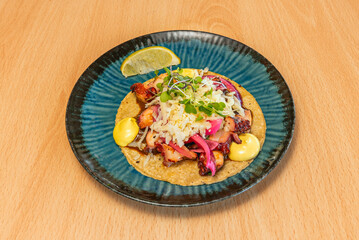  shrimp tacos with creamy chipotle sauce, avocado, and red onion on double tortillas