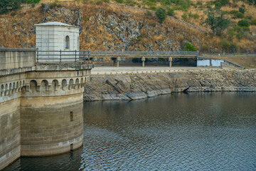 Night view of the reservoir with a full moon creating a silvery path over the dark, calm waters