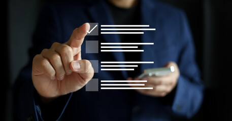 close up businessman hand check online questionnaire survey from website to rate score and share aspect of audience after complete from seminar for business corporation concept