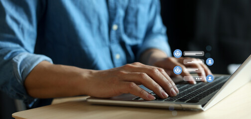 close up young man hand type question to ask and talk to AI robotic function to answer and help about system management for future technology and lifestyle concept