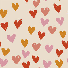 Vector abstract seamless pattern with red, yellow and pink hearts on beige. Hand painted love illustration for design, print, fabric or background.