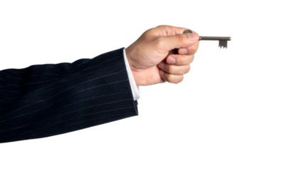 A hand holding a key, symbolizing opportunity, security, and access