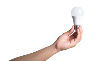 A hand holding an LED light bulb, symbolizing energy and innovation