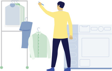Man hanging clothes on rack