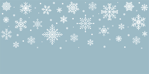 White snowflakes on light blue background. Gentle winter snowfall for Christmas and New Year design. Minimal frosty seasonal backdrop. Vector illustratio
