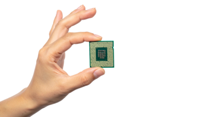 A hand holding a central processing unit (CPU)