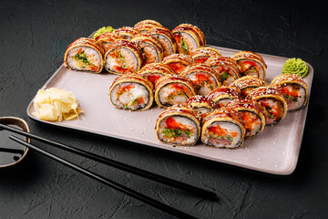 Sushi platter featuring various rolls with vibrant colors and toppings