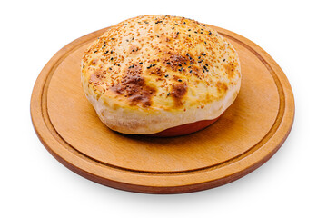 Freshly baked bread on a wooden board in a rustic kitchen setting