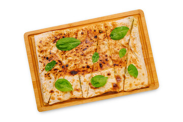 Delicious flatbread topped with fresh spinach on a wooden serving tray