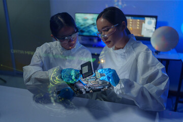 Engineers work in semiconductor or microchip labs in the electronics industry. Electronic engineers...