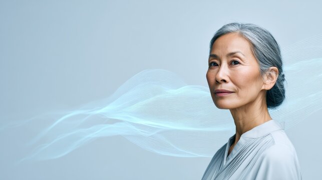Businesswoman with grey hair is posing in a studio with blue digital waves representing artificial intelligence data analysis and processing