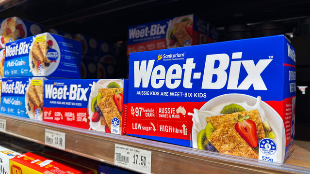 Weet-Bix boxes displayed on supermarket shelf with price tags visible in Malaysia