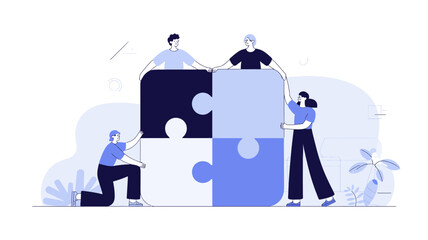 Diverse team of four people collaborating to assemble a large four piece puzzle symbolizing teamwork and shared goals