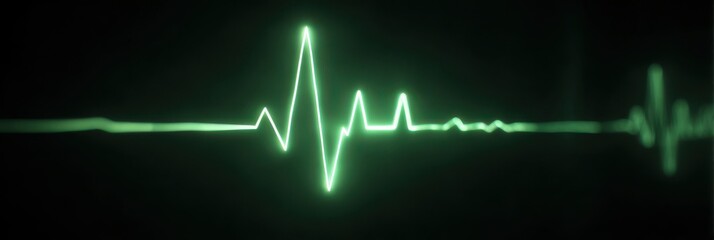 Green electrocardiogram waveform on a dark background
