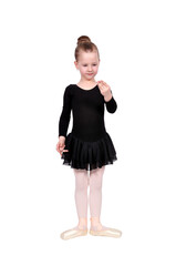 Young girl in ballet pose wearing a black tutu