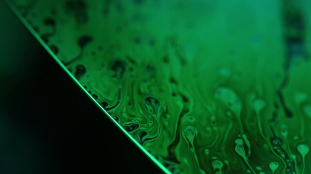Green liquid surface, phenomenal structure, green oils on a dark background, colourful luminous abstract, surrealistic art, line of light, glowing effects