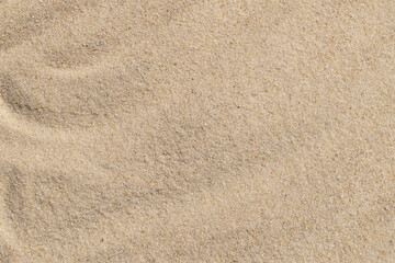Close-up of smooth textured beach sand surface