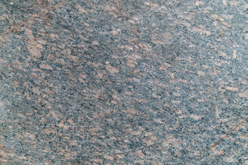 Granite surface texture with speckled gray and pink patterns