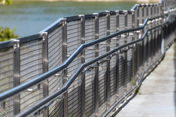 Outdoor metal pedestrian platform with grating and railings