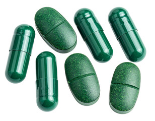 Green pills and capsules on a black background, assorted in shape and texture, providing an isolated medicinal feel