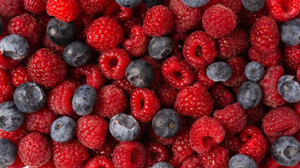 Raspberry, blueberry as a background.
