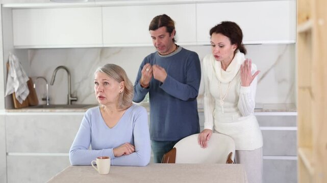 Married couple shouts at elderly mother. Family conflict between spouses and mother-in-law.