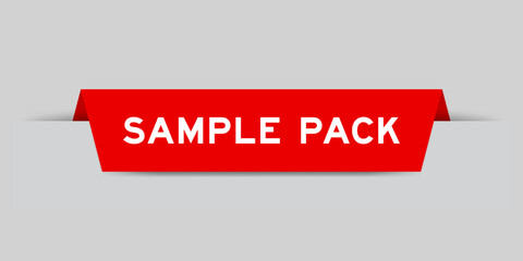 Red color inserted label with word sample pack on gray background