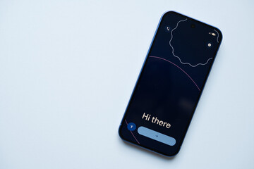Smartphone google mock up with dark interface displaying greeting message, featuring rounded edges and minimalistic design
