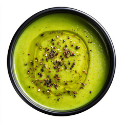 Vibrant green vegetable soup with olive oil drizzle and cracked pepper, served in a dark bowl.
