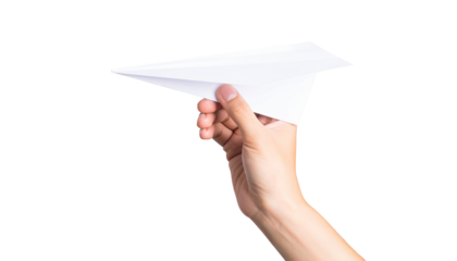 A person's hand launching a paper airplane
