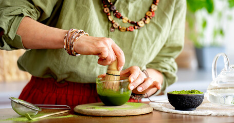 Woman Whisking Matcha Tea