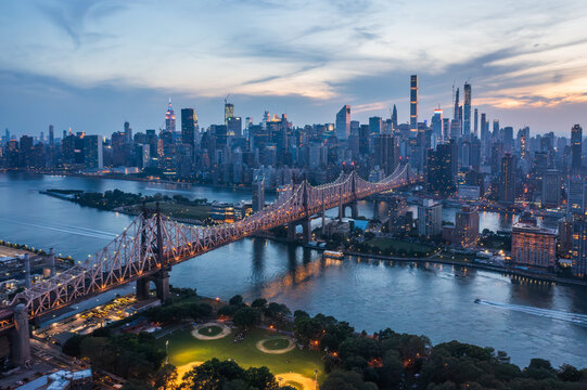 Aerial view of the Ed Koch Queensboro Bridge stretching across the East River, connecting to the vibrant skyline, New York, New York, United States.