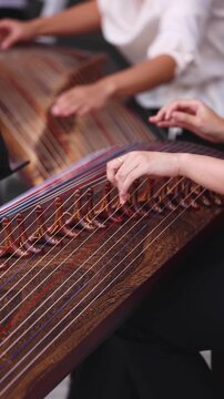 Traditional Korean folk musical instrument Gayageum, female orchestra band performing concert on Kayagum in of Seoul, South Korea, wooden zither with 12 strings, Koto or Guzheng live music performance