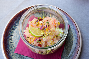Red Prawn Tartare with Raw Shrimp, Lime, Edible Flowers in Italian Tartare di Gamberi Crudi