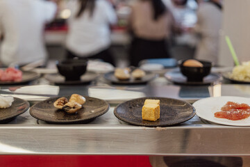 Tofu Cubes on Plate at Shabu-Shabu Conveyor Belt Restaurant