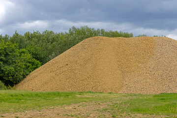 Large Pile of Aggregate Gravel Material at Road Construction Site