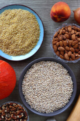 Assortment of various healthy fruits, vegetables, grains and legumes. Top view, wooden background.
