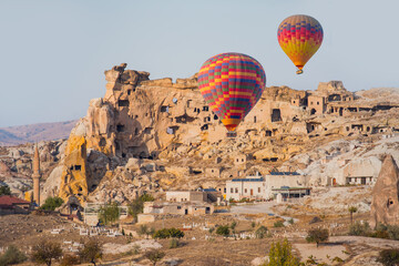 Hot air balloon flying over spectacular Cappadocia -  Goreme, Turkey