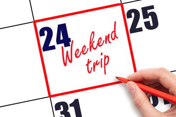 24 th day of the month.  Hand writing Weekend trip reminder and drawing red frame on calendar with red pen on white background. Business concept. Travel concept. Planning and scheduling