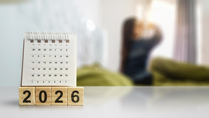 Wooden cubes with number of 2026 and calendar on the desk showing 1st January 2026 as the new year....