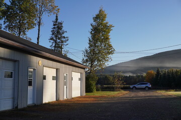Obraz premium garage door with the mountain view early morning