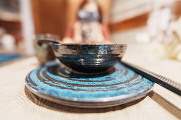 Close-up of blue and black patterned ceramic bowl and plate